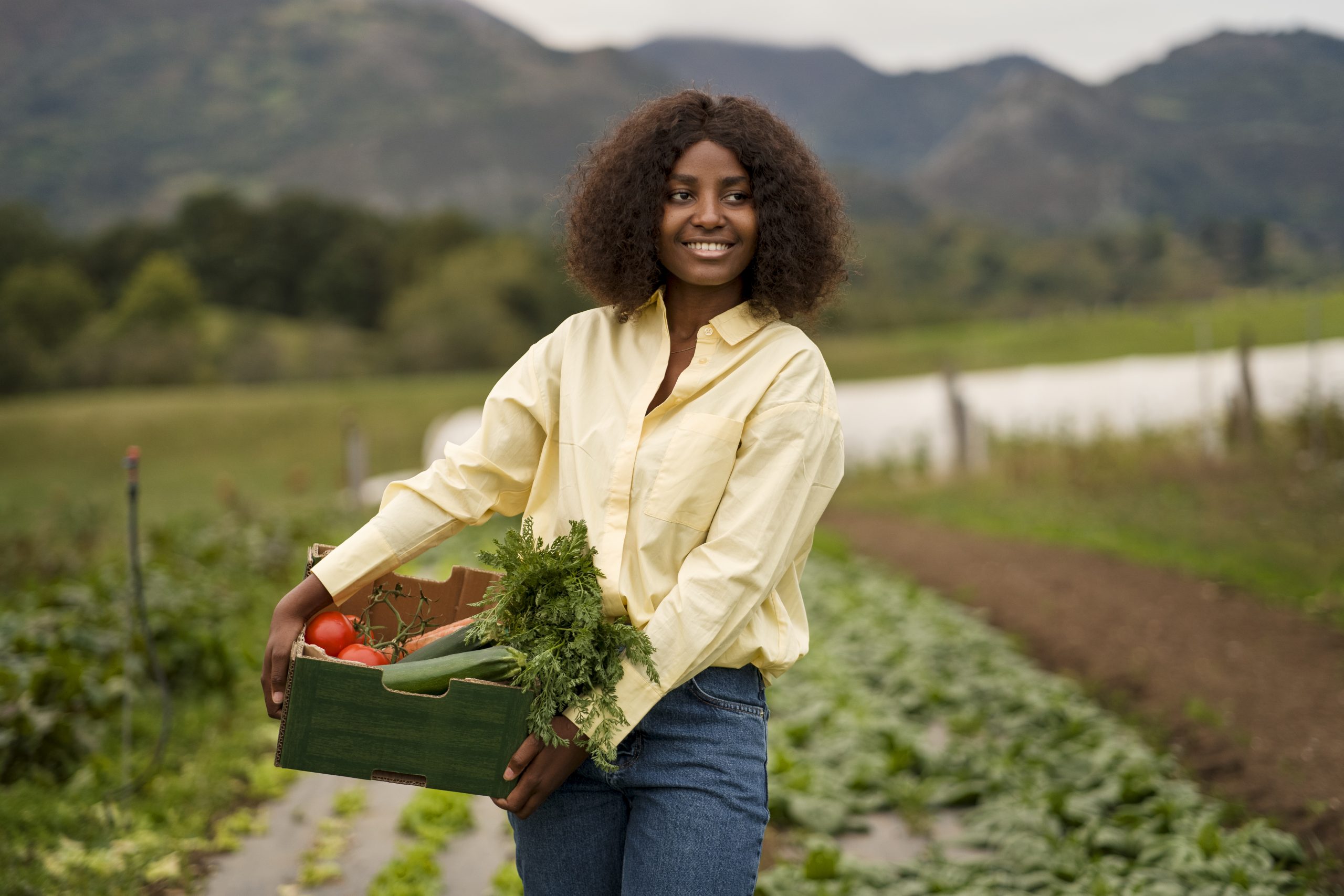 front-view-smiley-woman-holding-box